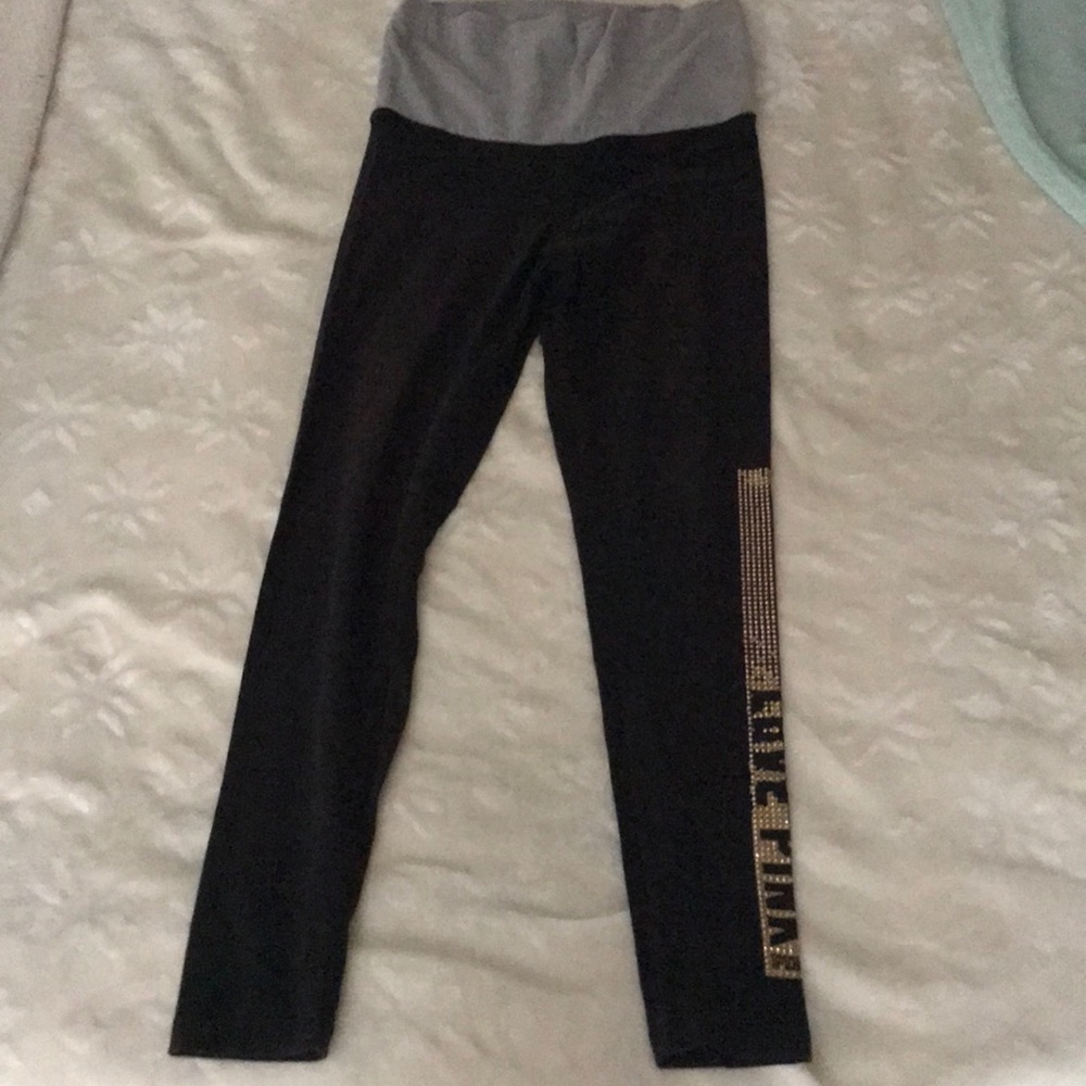 Black leggings with sequence on the left leg